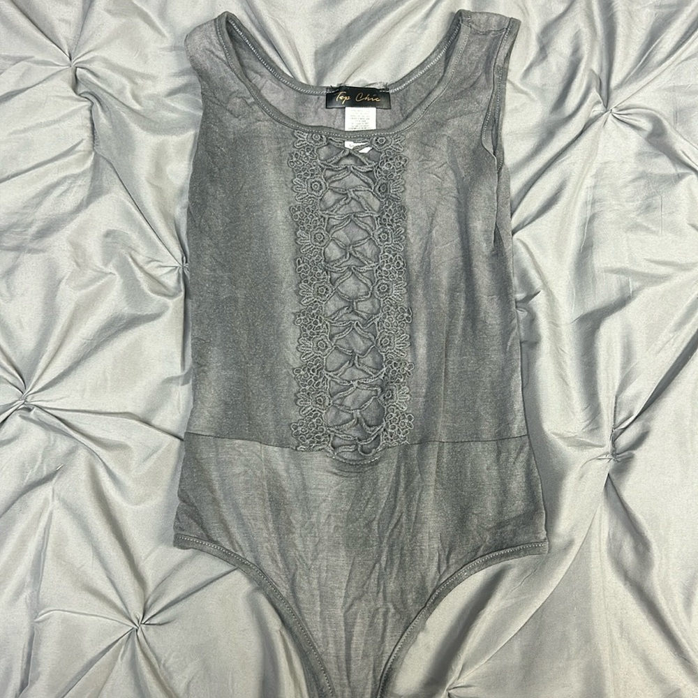 Grey cut out bodysuit. Size small. Never worn